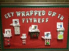 a bulletin board with wrapped up gifts on it