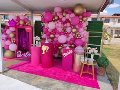 a pink and gold birthday party with balloons