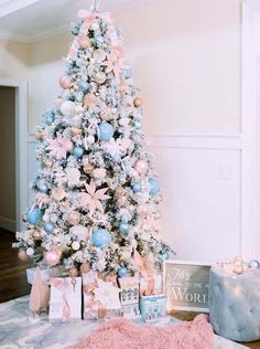 a flocked Christmas tree decorated with pastel pink and blush ornaments, pink fabric flowers and lights is gorgeous Pink Christmas Tree Decorations, Pastel Christmas Decor, Pink Feminine