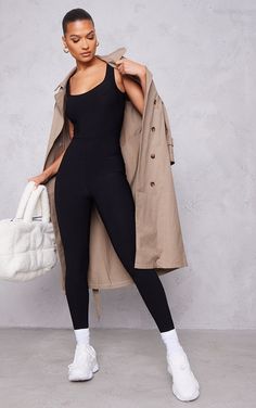 Jumpsuit And Trench Coat Outfit, Jersey Jumpsuit Outfit, Black Jumpsuit Airport Outfit, Jumpsuit With Trench Coat, Black Bodycon Jumpsuit Outfit, Jumpsuit Black Outfit, Romper Outfit Ideas