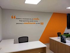 an office with orange and white walls