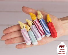 small crocheted toy animals are in the palm of someone's hand,