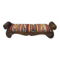 a wooden bench with multicolored cushions on it