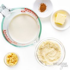 ingredients to make cheesecake sitting in bowls on a white surface with text overlay