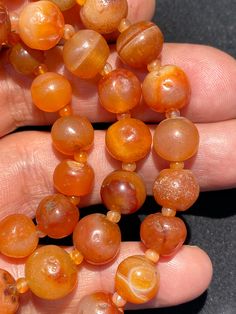 The orange color carnelian beads from my collections of ancient beads. The origin of this beads from Tibet although the carnelian agate can be found in Pakistan India Nepal and Afghanistan as well small agate beads used as counter beads best gift for the people who collect ancient beads and best for the people who study ancient history we provide fast and free shipping to our customers by which you can get the item by 7 maximum working days Orange Amulet Necklace With Round Beads, Round Carnelian Orange Beads, Orange Carnelian Beads For Spiritual Purposes, Orange Carnelian Hand-strung Necklace, Orange Agate Beads For Jewelry Making, Round Orange Carnelian Beads, Orange Carnelian Beads, Hand-strung Orange Carnelian Necklaces, Hand-strung Orange Carnelian Beaded Necklaces