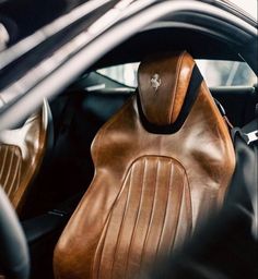 the interior of a car with leather seats