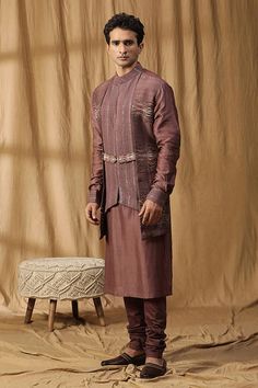 Purple kurta with embroidered panels, belted details and cuffed sleeves. Paired with a churidar. - Aza Fashions Designer Traditional Wear With Woven Motifs, Designer Embroidered Sets For Traditional Ceremonies, Festive Ceremonial Kurta With Woven Motifs, Designer Sets With Resham Embroidery For Traditional Ceremonies, Festive Sets With Woven Motifs And Traditional Drape, Eid Designer Wear Kurta With Woven Motifs, Purple Resham Embroidery Kurta In Chinon, Luxury Purple Formal Kurta, Purple Chanderi Kurta