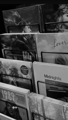 many cds are stacked on top of each other in black and white, with the word love written above them