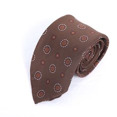 Elevate your style with the Sunflower Charm Tie in rich brown. Perfect for men and women, this tie exudes natural elegance, adding a touch of floral charm to your outfit. Crafted with precision and style, it's ideal for casual and formal occasions alike. Fitted Elegant Brown Neckwear, Elegant Fitted Brown Neckwear, Brown Standard Tie For Business, Luxury Brown Suit And Tie Accessories For Semi-formal Occasions, Dapper Brown Tie For Business, Fitted Brown Neckwear For Formal Occasions, Luxury Brown Suit And Tie Accessories For Business, Elegant Brown Suit And Tie Accessories For Business, Classic Brown Neckwear For Formal Occasions