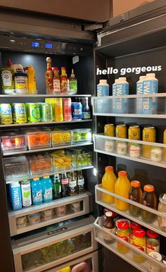 an open refrigerator filled with lots of food and drinks in it's door shelves