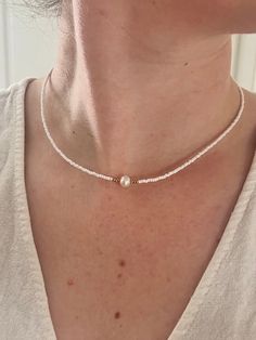 "bead necklace with freshwater pearl ♡ 💦 Waterproof ✅ Hypoallergenic  🛠 Highly Durable Great for layering with other necklaces. Stainless Steel and gold plated so will not fade or tarnish 💦 FREE UK SHIPPING - Upgrade options available 🚚 WORLDWIDE SHIPPING🌎 FREE GIFT WRAPPING🎁  Personalisation available. ECO-FRIENDLY♻️ Chain length: 17\" Share your new jewellery with us on Instagram! @echstudioco ♡ Feel Your Best For A Whole Lot Less♡ Happy shopping💓 Gold Necklace layer. Easter gift 🐣" Minimalist Beaded Necklaces With Pearl Charm, Minimalist Pearl White Beaded Necklaces With Pearl Charm, Minimalist Pearl White Beaded Necklace With Pearl Charm, Gift White Beaded Necklace With Pearl Drop, White Beaded Necklace With Pearl Drop For Gift, Dainty Everyday Beaded Pearl Necklace, Dainty White Beaded Necklace With Pearl Pendant, Minimalist White Pearl Chain Beaded Necklace, Pearl White Jewelry With Tiny Beads