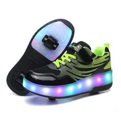 a pair of black and green shoes with neon lights on the soles are shown