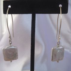 These edgy freshwater pearl earrings are very modern and geometric.  For a contemporary look, our sterling silver earrings are truly unique.   The earrings are handmade and just under 2 and a half inches in length. They have a drop of 1 inch and are 5/8 of an inch wide (.625 inches). Ultra contemporary and fun! Modern Pearl Earrings With Ear Wire For Everyday, Minimalist Sterling Silver Linear Earrings With Pearl Drop, Modern Everyday Pearl Earrings, Modern Silver Jewelry With Pearl Drop, Everyday Sterling Silver Linear Earrings With Pearl Drop, Modern Dangle Pearl Earrings For Everyday, Modern Everyday Dangle Pearl Earrings, Minimalist Nickel-free Pearl Earrings For Formal Occasions, Modern Single Pearl Earring For Everyday