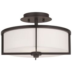 a flush light fixture with a white shade on the bottom and black metal trims