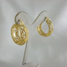 💎 Finely Crafted Jewelry. Made by master goldsmiths in Istanbul in our workshop. ❤️ Enjoy 18K gold for Less! What you see is gold, what touches your skin is 18k gold. ✓ Instant Glamour and Comfort - Statement Hoop Earrings ✓ Classic Timeless Filigree Hoop Earrings Design ✓ Length: 30 mm | 6/5 inch ✓ Width: 10 mm | 2/5 inch 100% Customer satisfaction guaranteed! Hassle free returns or exchanges. Reach out if you have any special requests and we'll make it happen! OTHER INFORMATION ✓ All items ar Ornate Hoop Jewelry For Pierced Ears, Gold Oval Earrings With Intricate Design, Yellow Gold Elegant Hoop Earrings For Formal Occasions, Formal Yellow Gold Hoop Earrings With Elegant Design, Heirloom Oval Gold Earrings, Oval Yellow Gold Earrings With Intricate Design, Filigree Hoop Jewelry As A Gift, Gold Filigree Small Hoop Jewelry, Small Hoop Gold Filigree Earrings