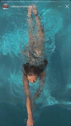 a woman is swimming in the water