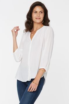 NYDJ's Pintuck Pleat Back Women's Blouse boasts a billowy long sleeve silhouette that's perfect when paired with any of our slimming Women's denim styles. Pleating at the back yoke creates a sophisticated yet easy drape. Split round neckline with covered full front placket and button closure. | NYDJ Women's Pintuck Blouse in Optic White, Regular, Size: Medium | Denim Classic 3/4 Sleeve Blouse For Fall, Classic 3/4 Sleeve Fall Blouse, Relaxed Fit Blouse With 3/4 Sleeves, Classic Fall Blouse With 3/4 Sleeves, Classic Blouse With 3/4 Sleeves For Fall, Classic 3/4 Sleeve Daywear Blouse, Classic 3/4 Sleeve Blouse For Daywear, Classic Blouse With 3/4 Sleeves For Daywear, Elegant Long Sleeve Blouse For Casual Gatherings