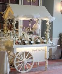 an image of a candy cart in the middle of a room with decorations on it