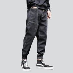 Take your fashion game to the next level with our 2023 Autumn Collection's street dark men's denim joggers! These monochrome. mid-waist joggers are perfect for making a statement. yet still keeping it comfortable and stylish. With their drawstring closure and stretchy fabric. they promise to keep you looking sharp even during the most intense streetwear looks.Why You'll Fall In Love Street Style: Make an impact with these joggers. designed to keep you looking your best no matter the season or oc Urban Tapered Leg Joggers For Streetwear, Casual Tapered Leg Joggers For Streetwear, Baggy Tapered Leg Joggers For Streetwear, Urban Straight Leg Joggers For Streetwear, Sporty Straight Leg Cargo Jeans For Streetwear, Sporty Denim Jeans For Streetwear, Dark Wash Tapered Leg Cargo Jeans For Streetwear, Sporty Black Denim Jeans, Modern Tapered Leg Jeans For Streetwear