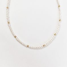 Genuine freshwater pearls & high quality 14k gold filled beads make this dainty choker an instant classic and summer staple. Dainty and perfect for every day. Length: 14” + 2” extender Genuine 3-4mm freshwater pearls & 3mm 14k gold filled beads Lobster clasp Each natural pearl is unique and therefore no two are alike. Pearls, colors and sizes may vary. Handmade with the highest standards & quality materials. Includes 100% organic cotton jewelry pouch This item is made to order and shipped with l White Single Strand Pearl Necklace With 14k Gold Filled, Dainty Single Strand Pearl Necklace In 14k Gold, Adjustable Delicate 14k Gold-filled Pearl Necklace, Adjustable Delicate 14k Gold Filled Pearl Necklace, Delicate Adjustable 14k Gold Filled Pearl Necklace, White Single Strand Pearl Necklace In 14k Gold, Dainty 14k Gold-filled Single Strand Pearl Necklace, Delicate Pearl Necklace With Tiny Beads For Everyday, Dainty Pearl Necklace With Tiny Beads