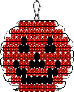 an ornament made out of red and black dots