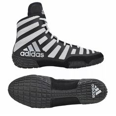 a pair of black and white adidas shoes