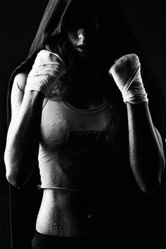 a woman in a green shirt and white gloves