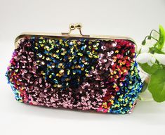 NOTE: ALL OF MY BAGS ARE HANDMADE TO CUSTOMERS INDIVIDUAL ORDERS!! This is a stunning and elegant handmade multi colour sequin embellished clutch purse, fully lined with Black satin fabric for a lovely contrast, and reinforced with heavy weight interlining and interfacing so it maintains its shape. All stress points have been double stitched for durability.  A very beautiful and unique bag, perfect for any special occasion, Parties, or Banquet events. The size is perfect to carry your essentials Sequin Purse, Sequin Clutch, Party Bag Fillers, Wallet Organization, Change Purse, Leather Pattern, Mini Wallet, Small Purse, Purse Clutch