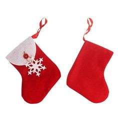 two red christmas stockings with white snowflakes hanging from them