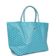 This Limited Edition St. Louis GM tote bag with a large Balise beach towel is in turquoise blue Goyardine coated canvas and chevroches calfskin leather with palladium hardware, contrast stitching, and comes matching detachable button closure wallet.The interior of the tote bag is lined with white canvas.The beach towel included is made of terry cloth and is multicolored with printed floating buoys.Origin: FranceCondition: New and never worn (plastic on handles)Accompanied by: Dustbag, felt, retail tag, removable pouch, towel dustbagMeasurements: tote bag: 15.7" x 13" x 7.8"; beach towel: 36" x 60" Luxury Turquoise Travel Bags, Luxury Rectangular Beach Bag, Luxury Blue Shoulder Bag For Summer, Designer Blue Summer Bag, Blue Summer Bags For Poolside, Blue Summer Poolside Bags, Blue Tote Bag For Poolside, Blue Rectangular Beach Bag For Poolside, Hermes Birkin 25