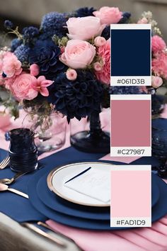 the table is set with blue and pink flowers