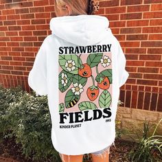 Is there a better way to spread the love for planet earth than wearing this aesthetic Strawberry hoodie. MADE TO ORDER ITEM - - FEATURES - - * Available in multiple colors, styles, and sizes  * 50% pre-shrunk cotton, 50% polyester * Medium Fabric (8.0 oz/yd (271.25 g/m)) * Front pouch pocket * Air-jet spun yarn with a soft feel and reduced pilling * Double-lined hood with matching drawcord * Quarter-turned body to avoid crease down the middle * 1 × 1 athletic rib-knit cuffs and waistband with sp Strawberry Hooded Blanket, Blanket Hoodie Strawberry, Strawberry Hoodie, Aesthetic Strawberry, Clothing Kawaii, Retro Fruit, Adorable Illustration, Positive Hoodie, Kawaii Fruit