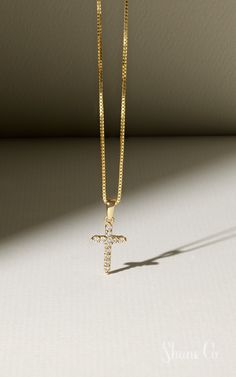 Celebrate Easter with this darling cross necklace. This sparkling cross is made up of 12 round diamonds. These hand-selected gems are set in quality 14k yellow gold, and the dazzling design hangs from a matching 18″ box chain. Article number: 41068462 Elegant Cross Necklace With Box Chain, Gold Cross Pendant Necklace With Box Chain, Gold Cross Necklace With Box Chain, Yellow Gold Cubic Zirconia Cross Necklace, Gold Cross Necklace With Diamond Accents, Elegant Cross Necklace With Box Chain For Gift, Elegant Crucifix Necklace With Box Chain, Yellow Gold Cross Necklace With Diamond Accents For Gift, Yellow Gold Cross Pendant Necklace With Diamond Accents