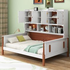 a bedroom with a bed, bookshelf and pictures on the wall above it