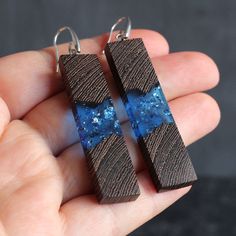 Stylish earrings made of wood and resin on silver clasp 925. This pair measures about 54 mm long and 13 mm wide. ► Your order will be packaged in a beautiful box, ideal for gifts, which is carefully packed in extra boxes for delivery. approximate delivery time takes 10-20 business days. ► Also look at all our wood resin jewelry - https://www.etsy.com/shop/SOGDbrand ► We also can produce our products under individual size and take into account all the wishes of the client. If you have any questio Handmade Natural Wood Earrings As Gift, Handmade Natural Wood Earrings For Gift, Wooden Anniversary Gift, Wood Resin Jewelry, Jewelry Casual, Resin Pendants, Earrings Wood, Casual Earrings, Stylish Earrings