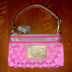 This Is A Beautiful Pink And Gold Coach Vintage Wristlet. Condition Is Brand New And Never Used. Pink Pouch Wristlet With Strap, Pink Pouch Wristlet With Zipper Closure, Pink Clutch Wristlet With Zipper Closure, Pink Wristlet With Removable Pouch As Gift, Pink Pouch Wristlet With Wrist Strap, Pink Clutch Wristlet As A Gift, Pink Wristlet With Zipper Pouch As Gift, Pink Coach Bag As Gift, Pink Wristlet With Removable Pouch