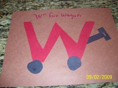 a paper cut out of the word w for wagon on top of a granite counter