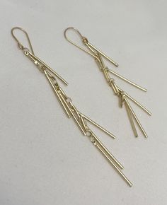 Boho statement dangle earrings, in shiny gold, perfect for a night out or festival weekend. Fringe style, resembles a tassel or tiny spikes. Ear wires are 14k gold-filled. Lightweight and easy to wear. 3.5" length.  See my other listings for silver or two tone earring choices. Trendy Gold Fringe Earrings, Long Drop Metal Tassel Earrings For Party, Long Drop Tassel Earrings For Party, Gold Fringe Metal Chandelier Earrings, Gold Fringe Chandelier Earrings, Metal Chandelier Earrings With Tassels For Party, Adjustable Gold Tassel Earrings For Party, Gold Metal Tassel Earrings For Party, Modern Tassel Drop Earrings For Party