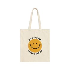 a tote bag that says it's a good day and has a smiley face