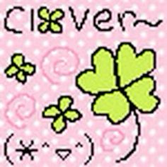 a cross stitch pattern with clovers and hearts on the front, in pink background