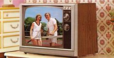 an old television with a photo of two people holding tennis racquets on it