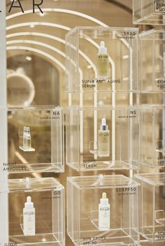 the display case is filled with many different types of skin care products in clear acrylic containers