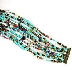 "Color Block" 10 Strand Turquoise Multi-Color Iridescent & Glass Beads Bracelet Dimensions: Approx. Length Of 7.5" X 1.25 " Wide. Easy To Open/Close Double Magnetic Clasp. Bracelet Is Handmade In Guatemala Using Artisan Crafted Czech Glass Beads. Each Bracelet Is Unique, No Two Are Ever Exactly The Same; Handmade Principles Of Fair Trade Are Upheld Visit Our Posh Closet See The Complete Collection Bracelets, Necklaces, Earrings Glass Beads Bracelet, Enchanted Jewelry, Clasp Bracelet, Glass Beaded Bracelets, Strand Bracelet, Czech Beads, Beads Bracelet, Magnetic Clasp, Artisan Craft