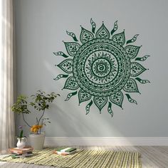 a green and white wall decal with an ornate sunflower design in the center