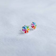 Real 925 Sterling Silver Colorful Rainbow Boho Flower Stud Earrings These lovely earrings can be used in Earlobe, Tragus and Cartilage. Made from colorful Enamel Measures 7mm Comes with pushback backings Sold by Pair Jewelry will come in a gift box * Please read shop policy before placing an order * *JEWELRY CARE* Sterling Silver will tarnish over time, but to help keep your jewelry looking beautiful - Clean with a soft dry cloth after wear and store inside an airtight bag or container. Remember Cheap Rainbow Flower Shaped Jewelry, Cute Rainbow Hypoallergenic Earrings, Funky Rainbow Earrings For Gift, Rainbow Sterling Silver Earrings, Happy Rainbow Flower Earrings, Paired Jewelry, Flower Earrings Studs, Flower Studs, Lovely Earrings