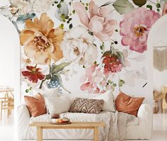 a living room with flowers painted on the wall