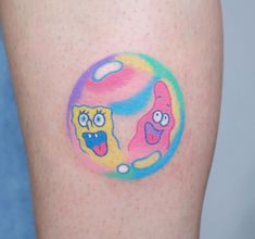 an image of two cartoon characters on the thigh