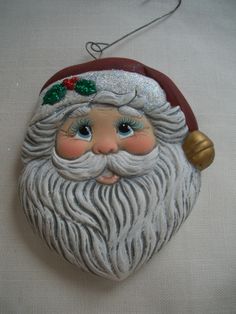 a santa claus ornament hanging on a wall