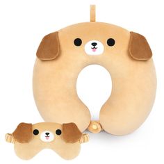 two stuffed animals are next to an inflatable dog head and eye pillow on a white background