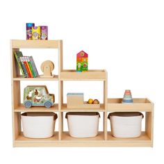 a wooden shelf filled with lots of toys and books on top of each shelf in front of a white background